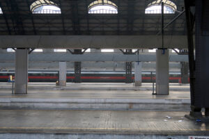 Milan, Central Station. The almost empty station is a red arrow train - MyVideoimage.com