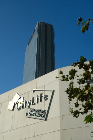 Milan Citylife shopping district. Citylife shopping district and the Allianz tower designed by Arata Isozaki. CityLife includes three skyscrapers and pedestrian areas with greenery. - MyVideoimage.com | Foto stock & Video footage