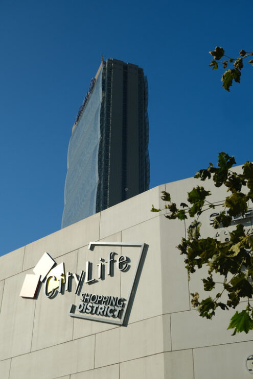 Milan Citylife shopping district. Citylife shopping district and the Allianz tower designed by Arata Isozaki. CityLife includes three skyscrapers and pedestrian areas with greenery. - MyVideoimage.com | Foto stock & Video footage