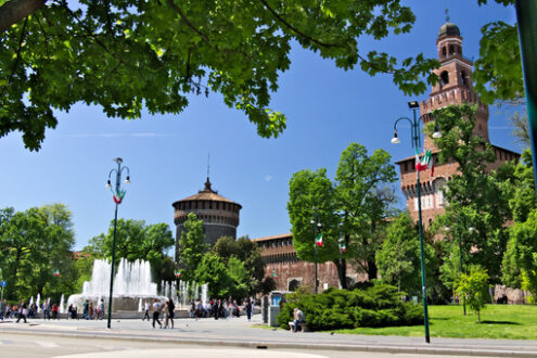 Milan castle. Sforza Castle. The red brick walls and the tower. Many people walk. - MyVideoimage.com | Foto stock & Video footage