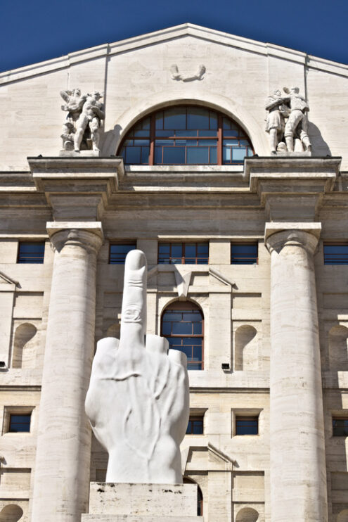 Milan stock exchange. Sculpture of Cattelan’s finger in front of the Milan Stock Exchange. The Milan Stock Exchange building in Piazza Affari with the work of Maurizio Cattelan. - MyVideoimage.com | Foto stock & Video footage