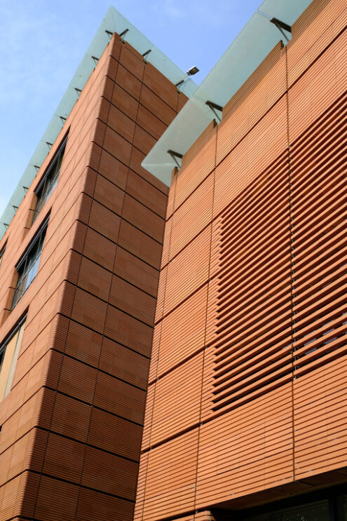 Modern  brick building. Modern building with terracotta brick facade. Stock photos. - MyVideoimage.com | Foto stock & Video footage