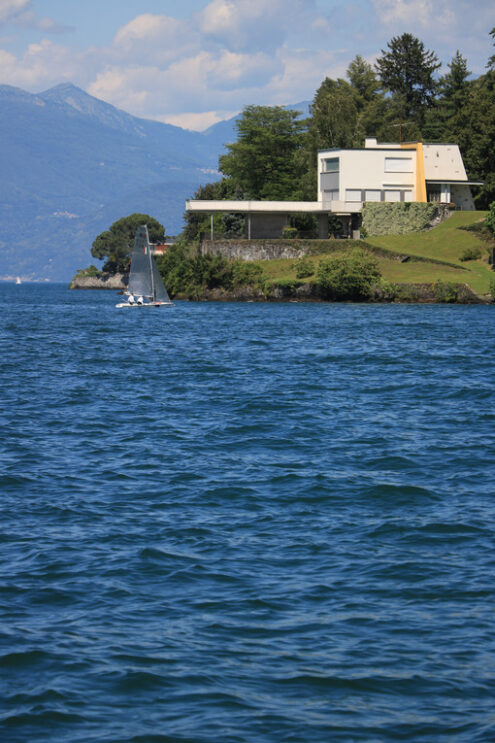 Modern house on the lake shore. A building with a design from th - MyVideoimage.com