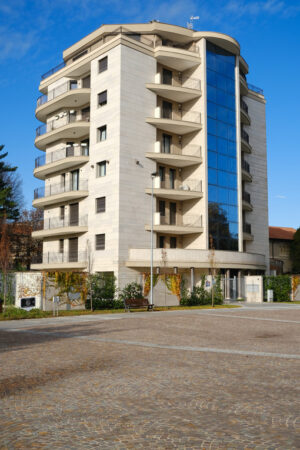 Modern tower building for residential apartments in the city center of Busto Arsizio. Marble cladding and porphyry floor by Trentino. - MyVideoimage.com