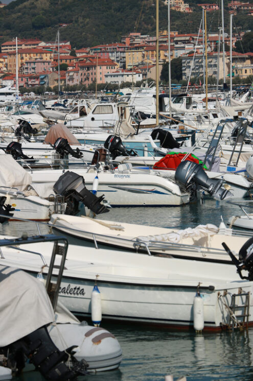 Motorboats photos. Motorboats anchored in the port of Lerici. In the background the houses of the village. - MyVideoimage.com | Foto stock & Video footage