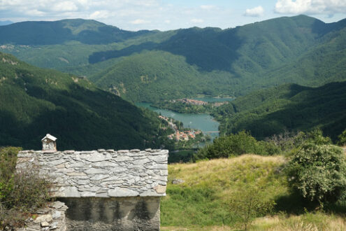 Mountain houses in Campocatino, in the green valley of the Apuan Alps mountains. Alpine landscape with a small village.