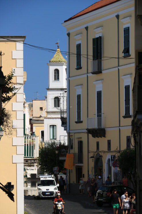 Narrow street of the small village of Ischia Ponte. In the backg - MyVideoimage.com