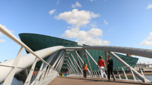 Nemo and steel pedestrian bridge over a canal in Amsterdam. In t - MyVideoimage.com