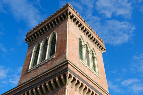 Neo-Gothic tower. Textile Museum in Busto Arsizio. Neo-Gothic construction in terracotta bricks with turrets and ogival windows. - MyVideoimage.com