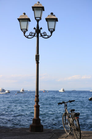 Nineteenth-century street lamp and parked bicycle. In the backgr - MyVideoimage.com