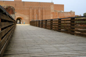 Novara Castle. Wooden bridge and brick castle walls. Stock photos. - MyVideoimage.com | Foto stock & Video footage