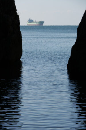 Oil tanker in the sea. Oil tanker In the middle of the sea between two rocks. - MyVideoimage.com | Foto stock & Video footage