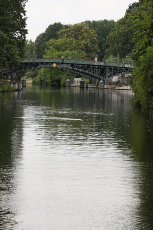 Old iron bridge over the river in Berlin. At the edges a thick v - MyVideoimage.com