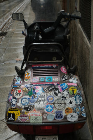 Old scooter. Scooter with advertising stickers. Stock photos. - MyVideoimage.com | Foto stock & Video footage