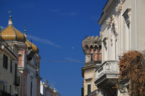 Oriental style dome and buildings with floral decorations on the island of Ischia. Blue sky. - MyVideoimage.com