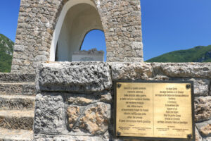 Ossuary monument of Sant’Anna di Stazzema. Nazi massacre of 12 August 1944. Plaque affixed by the presidents of the Italian and German republics. - MyVideoimage.com