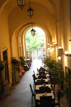 Outdoor venue Restaurant with tables under the portico. Stock photos. - MyVideoimage.com | Foto stock & Video footage