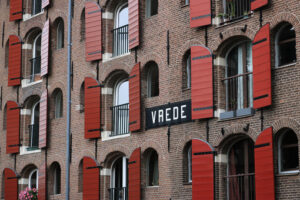 Palace windows with brick façade in Amsterdam. Vrede. - MyVideoimage.com