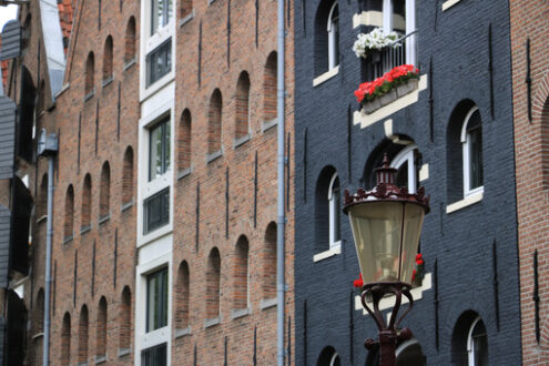 Palace windows with brick façade in Amsterdam. Vrede. - MyVideoimage.com