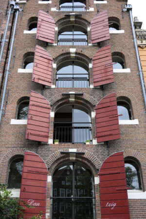 Palace windows with brick façade in Amsterdam. Vrede. - MyVideoimage.com