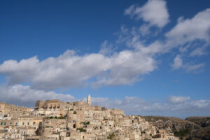 Panorama di Matera. Panorama of houses and of the Sassi of Matera with roofs and streets. Blue sky with - MyVideoimage.com | Foto stock & Video footage