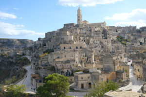 Panorama di Matera. View of the city of Matera in Italy. Church with bell tower and houses built in beige tuff stone. - MyVideoimage.com | Foto stock & Video footage