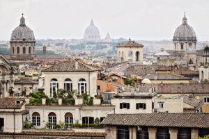 Panorama of Rome. Panorama of Rome’s rooftops with three church domes. Photograph - MyVideoimage.com | Foto stock & Video footage