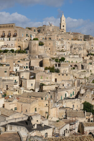 Panorama of southern Italy. Panorama of houses and of the Sassi of Matera with roofs and streets. Blue sky with - MyVideoimage.com | Foto stock & Video footage