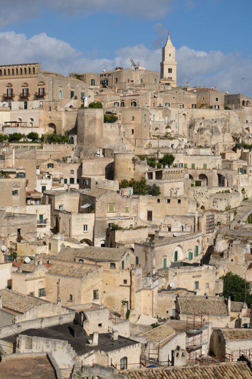 Panorama of southern Italy. Panorama of houses and of the Sassi of Matera with roofs and streets. Blue sky with - MyVideoimage.com | Foto stock & Video footage