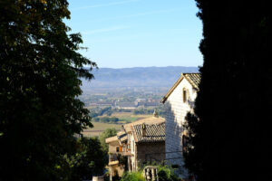 Panorama of the Assisi countryside with churches, houses and trees. From the top of the city you can enjoy a splendid panoramic view of the valley. - MyVideoimage.com