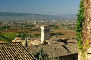 Panorama of the Assisi countryside with churches, houses and trees. From the top of the city you can enjoy a splendid panoramic view of the valley. - MyVideoimage.com