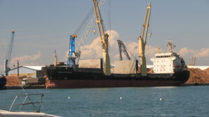 Panoramic view of the port. A Cargo ship and a ferry are anchore - MyVideoimage.com