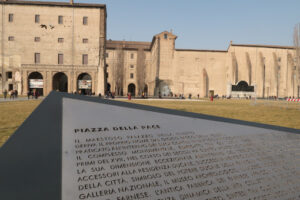 Peace Square in Parma. Steel table with engraved characters. Palazzo della Pilotta and gardens in winter. - MyVideoimage.com