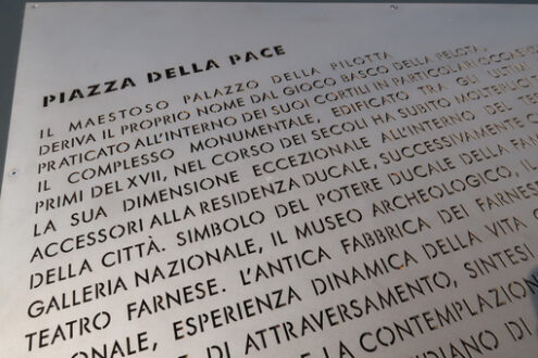 Peace Square in Parma. Steel table with engraved characters. Palazzo della Pilotta and gardens in winter. - MyVideoimage.com