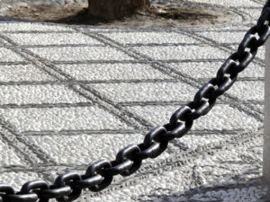 Pebble marble floor and large iron chain. - MyVideoimage.com