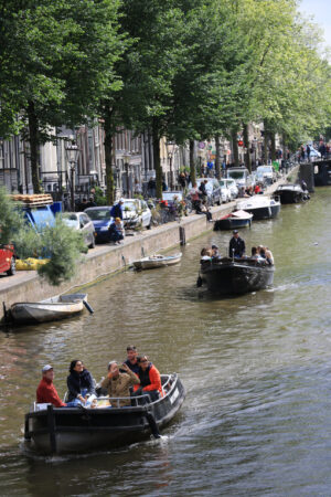 People on a tourist boat trip on the canals of the city of Amsterdam - MyVideoimage.com