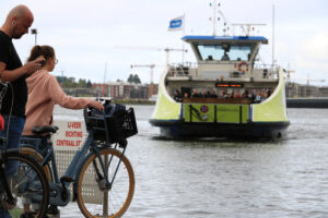 People with bicycles waiting for the ferry. - MyVideoimage.com