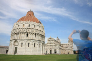 Photography with smartphone. Pisa, Tuscany. Piazza dei Miracoli of Pisa. People photograph with smartphone the monuments and the leaning tower. - MyVideoimage.com | Foto stock & Video footage