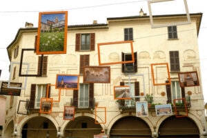 Photos hanging. Frames with photographs hanging outside. Stock photos. - MyVideoimage.com | Foto stock & Video footage