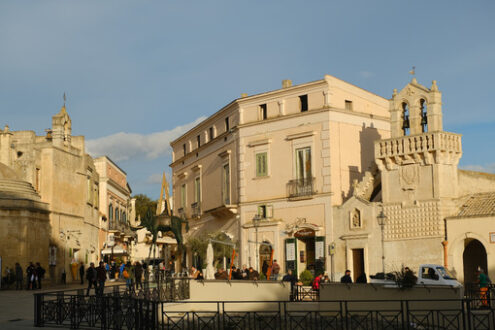 Piazza Matera. Piazza Vittorio Veneto in Matera. Materdomini Church and bronze elephant sculpture in the style of Salvador Dalì. - MyVideoimage.com | Foto stock & Video footage