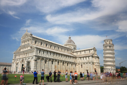 Pisa Cathedral and leaning tower. Piazza dei miracoli of Pisa. Cathedral, leaning tower of the Tuscan city. Blue sky with clouds. - MyVideoimage.com | Foto stock & Video footage