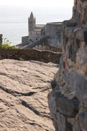 Portovenere church among the rocks. Bell tower and church of San Pietro in Portovenere. - MyVideoimage.com | Foto stock & Video footage