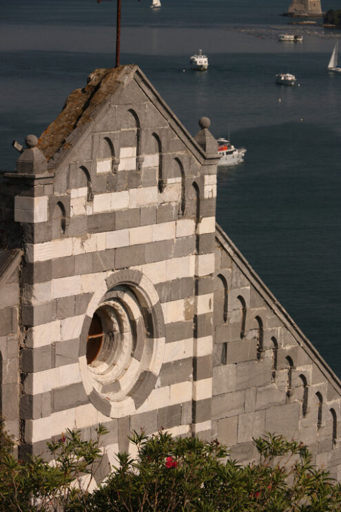 Portovenere church facade. Detail of the facade of the church of Portovenere in white and gray marble in typical Romanesque style. - MyVideoimage.com | Foto stock & Video footage