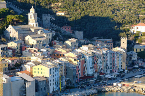 Portovenere panorama, near the Cinque Terre in the light of sunset. Colorful houses, the church, with walls. - MyVideoimage.com | Foto stock & Video footage