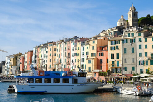 Portovenere village with colorful houses. Near the Cinque Terre. Typical colorful houses, the harbor with boats and the church. - MyVideoimage.com | Foto stock & Video footage