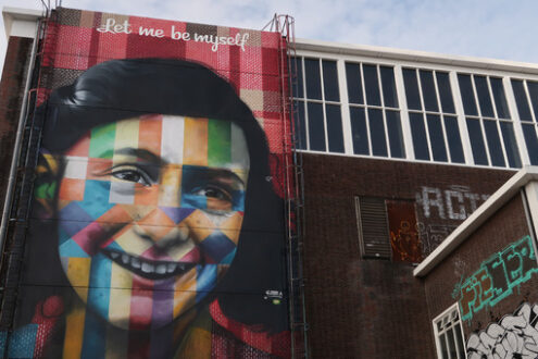 Portrait of Anne Frank in a mural in Amsterdam. A large painting - MyVideoimage.com