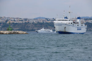 Procida ferry boat. Ferry boat in the Gulf of Naples. In the background, the seaside - MyVideoimage.com | Foto stock & Video footage