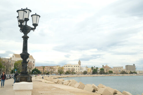 Promenade of Bari with the buildings of the old village. View of the port and the sea near the ancient Mediterranean city. Foto Bari photo.