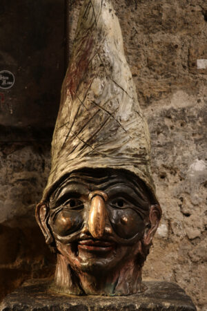 Pulcinella mask. Bronze sculpture of the typical mask of Campania and Naples. - MyVideoimage.com