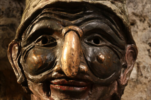 Pulcinella mask. Bronze sculpture of the typical mask of Campania and Naples. - MyVideoimage.com